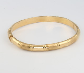 An 18ct yellow gold bamboo finished bangle, gross 18 grams