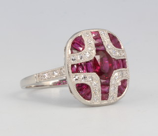 A platinum Art Deco style ruby and diamond cluster ring size N