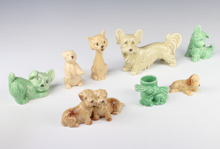 A Sylvac figure of a terrier 1415 11cm, a ditto of a green puppy 1646 6cm, a puppy on its hind legs 9cm, a pair of terriers 166 15cm, a green terrier 73 9cm, a spaniel 7cm and a pair of rabbits, match holder 1590 7cm 