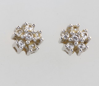 A pair of 18ct white gold diamond cluster ear studs