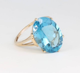A 9ct yellow gold oval topaz ring size O 1/2