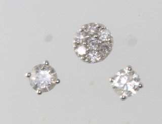 A pair of white gold diamond stud earrings approx 0.2ct and a single cluster ditto 