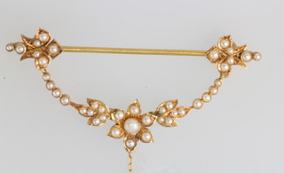 An Edwardian yellow gold seed pearl brooch 