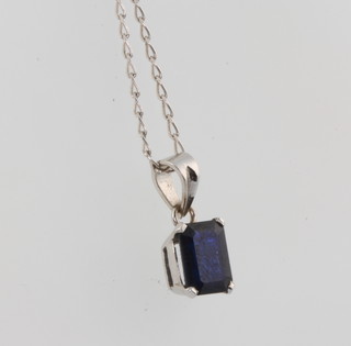 An 18ct white gold sapphire pendant approx. 1.25ct on a ditto chain 