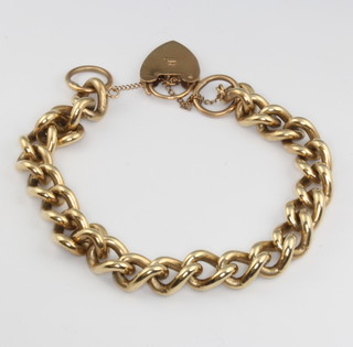 A 9ct yellow gold curb link bracelet with padlock 37 grams