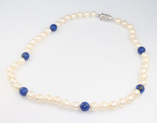 A cultured pearl and lapis lazuli necklace with a silver clasp 41cm 