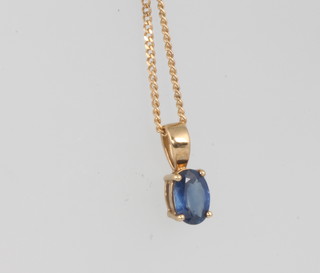 A 9ct yellow gold oval cut sapphire pendant approx. 0.75ct on a 9ct chain 