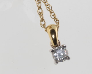 An 18ct yellow gold single stone diamond pendant approx. 0.25ct on a ditto chain 