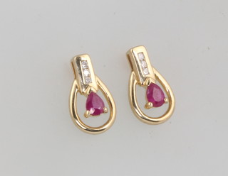 A pair of yellow gold pear cut ruby and diamond earrings 13mm 