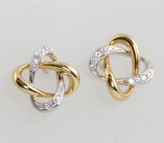 A pair of 18ct  2 colour gold diamond twist earrings 2.8 grams