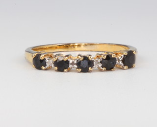 A 9ct yellow gold gem set ring size R 