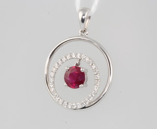 An 18ct white gold ruby and diamond double ring pendant 2.1 grams, 25mm