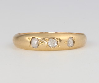 A yellow gold 3 stone diamond gypsy ring size I 1/2