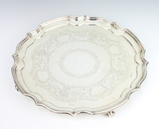 An Edwardian silver salver with Chippendale rim, chased with scrolls and vacant cartouche, on scroll feet, Sheffield 1901, 29.5cm 900 grams