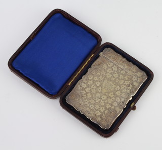 A Victorian silver card case with chased decoration and monogrammed cartouche in a fitted case 54 grams, rubbed marks