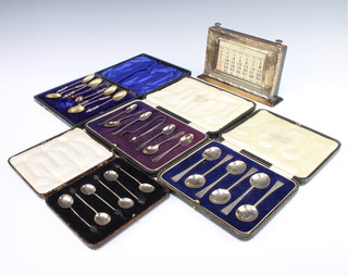 A set of 6 stylish silver coffee spoons Sheffield 1926, 3 other cased sets and a silver desk top calendar, weighable silver 218 grams gross 