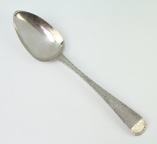 A William IV silver table spoon with chased decoration, makers mark T.DG.J.LG 40 grams
