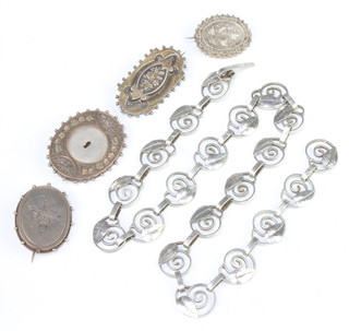 A silver necklace and 4 brooches, 75 grams