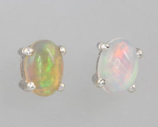 A pair of opal ear studs
