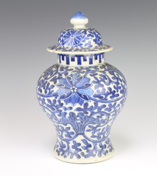 A 19th Century Chinese blue and white oviform vase and cover with stylised flowers and double ring mark to base 27cm 