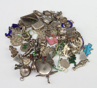 A quantity of silver charms 111 grams