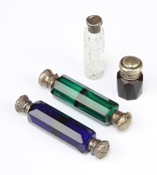 An Edwardian silver mounted cut glass scent bottle and 3 others 