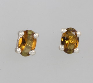 A pair of silver citrine ear studs 