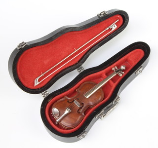 A miniature silver mounted model of a violin by Sacchetti 9cm together with a ditto bowl 9cm in a silver mounted case 13cm 