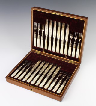 A set of 12 silver plated dessert eaters with mother of pearl handles in a fitted canteen, 2 part canteens of cutlery and a large quantity of plated cutlery 