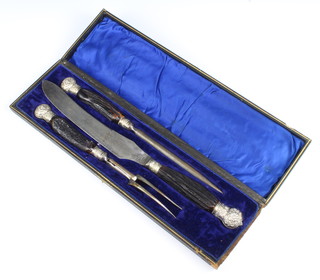 An Edwardian silver mounted, horn handled, 3 piece carving set, cased