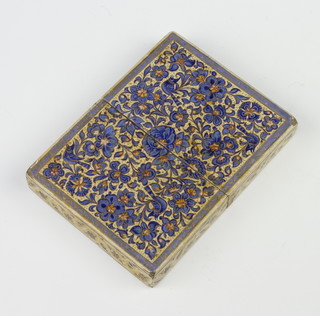 A Persian paper mache painted card case decorated with scrolling flowers 