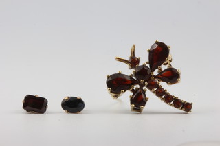 A 9ct yellow gold garnet set dragonfly brooch, 2 odd ear studs