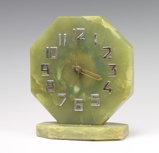 An Art Deco electric mantel timepiece with octagonal green onyx dial and silvered Arabic numerals 