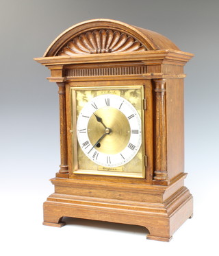 A single fusee bracket clock with 16cm brass dial and enamelled chapter ring, contained in an oak arch shaped case with plain 17cm brass back plate  