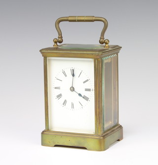 A 19th/20th Century French 8 day carriage clock with enamelled dial and Roman numerals contained in a gilt metal case, the back plate marked RCC85, 13cm x 9cm x 8cm complete with key 