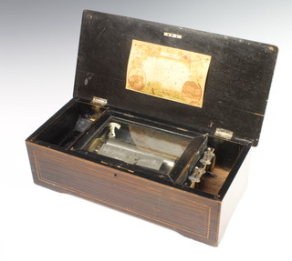A 19th Century cylinder musical box playing 8 aires contained in an inlaid rosewood box 12cm h x 43cm w x 20cm d 