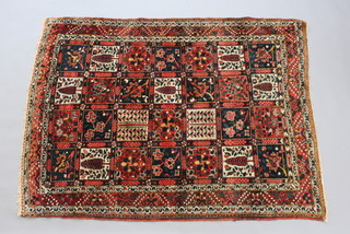 A blue and red ground Bakhtiari rug formed of 28 panels 205cm x 154cm  