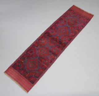 A red and blue ground Meshwani runner with 5 diamonds to the centre 260cm x 70cm 