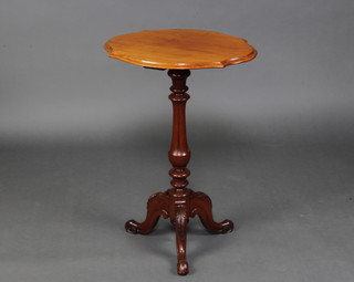A Victorian shaped bleached walnut wine table raised on a turned and fluted column with carved tripod base 72cm h x 51cm w x 43cm d 