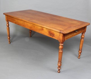 A 19th Century cherry farmhouse dining table with 3 plank top fitted a drawer and pastry slide, raised on turned supports 74cm h x 172cm l x 81cm w 