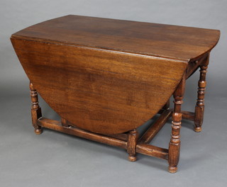Titmarsh and Goodwin, a 17th/18th Century oak oval drop flap gateleg dining table fitted 2 drawers, raised on turned and block supports 76cm h x 182cm l x 71cm w