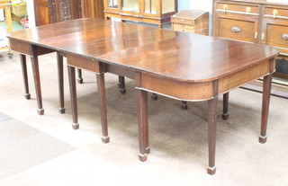 A Georgian mahogany D end dining table with gateleg action to the centre, raised on square tapered supports ending in spade feet 73cm h x 110cm w x 173cm l x 294cm when extended 