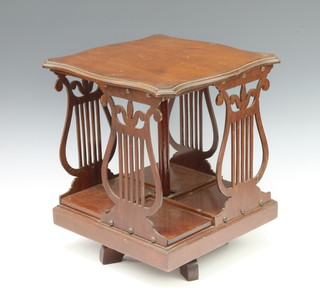 An Edwardian Globe Wernicke square mahogany table top revolving bookcase of serpentine outline and with pierced lyre panel decoration to the sides 37cm x 32cm x 32cm 
