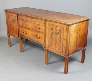 An Edwardian Chippendale style carved mahogany sideboard fitted a secret drawer above 2 long drawers flanked by a pair of cupboards, raised on turned and reeded supports 35cm h x 180cm w x 60cm d 