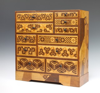 A Japanese inlaid pine cabinet fitted 4 long and 7 short drawers 46cm x 45cm x 17cm 
