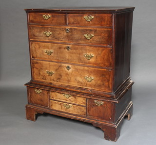 A Queen Anne figured walnut chest on stand, fitted 2 short and 3 long drawers, the base fitted 2 long and 2 short drawers, raised on bracket feet 119cm h x 95cm w x 54cm d  (Made up) 