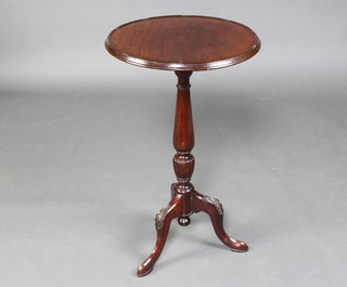 An Edwardian, Georgian style circular mahogany wine table raised on a pillar and tripod base 74cm h x 46cm diam. 