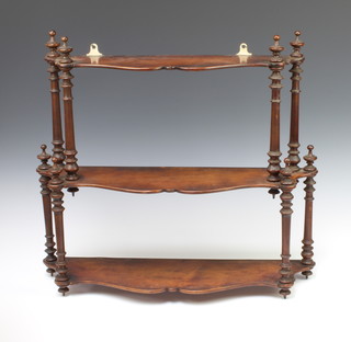 A Victorian mahogany 3 tier hanging shelf of serpentine outline with turned decoration 52cm x 58cm x 18cm 