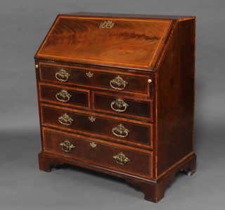 A George III inlaid mahogany bureau, the fall front revealing a stepped interior with well above 2 short and 2 long drawers 109cm h x 94cm w x 54cm d 