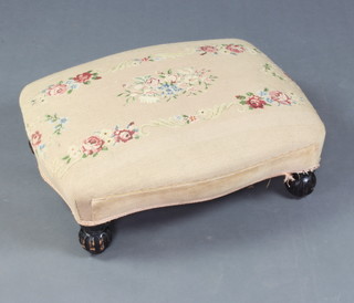 A Victorian footstool of serpentine outline with Berlin woolwork seat, raised on turned bun feet 20cm h x 67cm w x 54cm d 